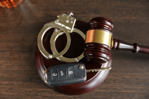gavel, car keys and handcuffs