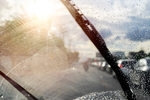 photo illustr of dirty window from inside car