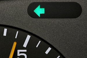 stock image of a left-turn signal on a car dashboard