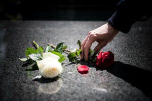 hand-flowers-burial