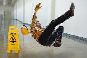 worker slipping on wet surface